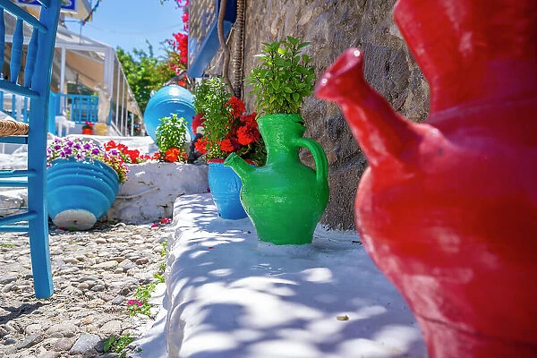 View of colourful jugs and furniture in local Taverna, Kos Town, Kos, Dodecanese, Greek Islands, Greece, Europe