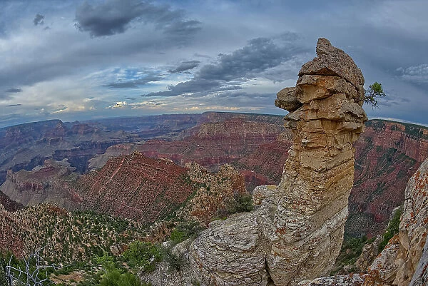View of Grand Canyon and a rock spire from within a gap between a stack of balanced boulders at Grandview Point, Grand Canyon National Park, UNESCO World Heritage Site, Arizona, United States of America, North America