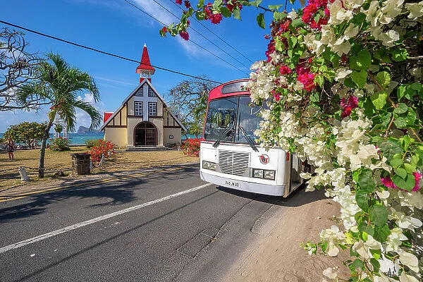 View of local bus and Notre-Dame Auxiliatrice de Cap Malheureux, Cap Malheureux, Mauritius, Indian Ocean, Africa
