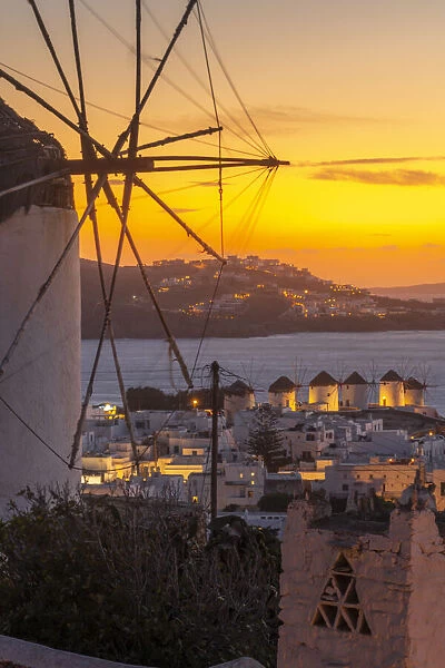 View of the windmills and town from elevated position at dusk, Mykonos Town, Mykonos
