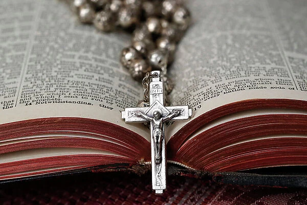 Vintage rosary with crucifix on an open Bible, Christian religious symbol, France, Europe