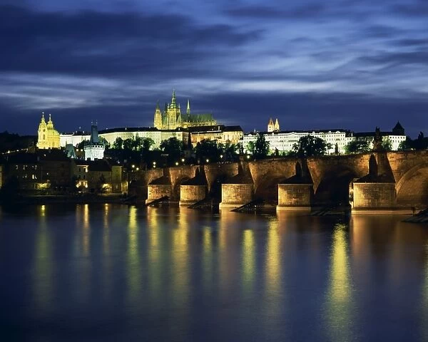 The Vltava River and Charles Bridge with St. Vitus Cathedral and St. Nicholas Church on the skyline of the city of Prague, Czech