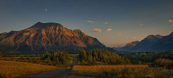 Waterton-Glacier mountains at sunset, UNESCO World Heritage Biosphere site with a lone