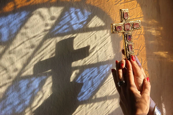 Woman holding a cross, Servoz, Haute-Savoie, France, Europe