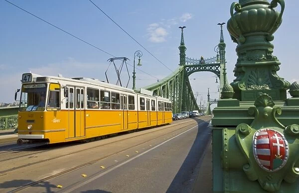 Yellow tram on The Liberty Bridge (Szabadsag hid), over the Rver Danube