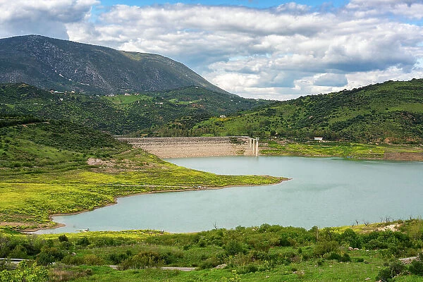 Zahara de la Sierra water reservoir dam with turquoise water and mountains in the background, Andalusia, Spain, Europe