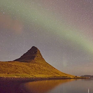 The Aurora Borealis (Northern Lights) seen in the night sky above Grundarfjordur