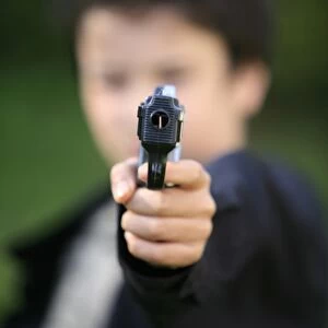 Boy with toy gun, Le Souillard, Eure, France, Europe