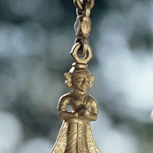 Detail of brass chain from which a swing chair