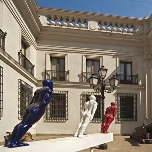 Cannon and modern art on display in an inner courtyard of the Palacio de La Moneda