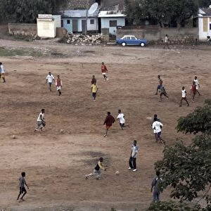 Children play football on a dirt pitch in Harar, Ethiopia, Africa