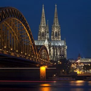 Cologne cathedral, UNESCO World Heritage Site, and Hohenzollern bridge at dusk, Cologne, Germany, Europe