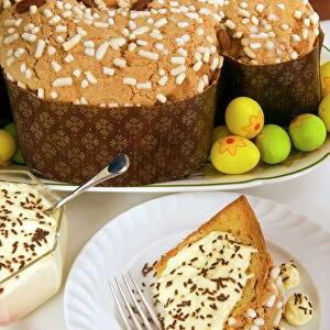 Colomba cake (dove cake) with cream sauce, an Italian speciality for Easter Day