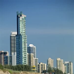 Couple walking along beach at the resort of Surfers Paradise on the Gold Coast of Queensland