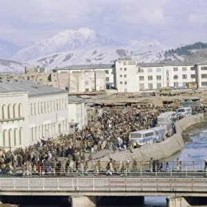 Crowds of people and buses in the city, Kabul, Afghanistan