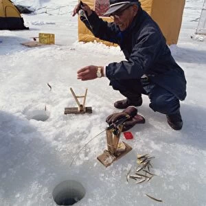 Ice fishing, Minami Furano Lake, Hokkaido, Japan, Asia