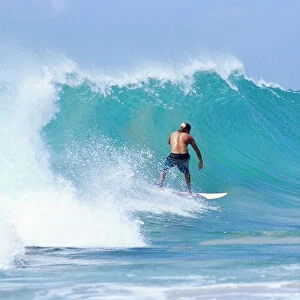 Man surfing at Praia do Boldro, Parque Nacional de Fernando de Norohna