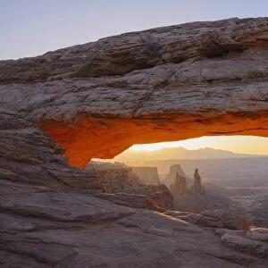 Mesa Arch at dawn looking towards Washerwoman Arch, Islands in the Sky section of Canyonlands National Park, Utah, United States of America, North America