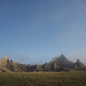 Morning mist rises in Badlands National Park, South Dakota, United States of America