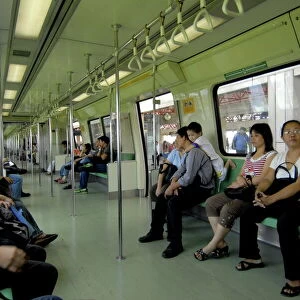 Passengers on a mass rapid transit train in Singapore, Southeast Asia, Asia