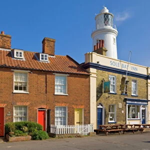 The Sole Bay Inn pub with Southwold lighthouse behind, Southwold, Suffolk