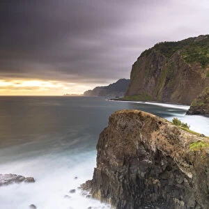 Storm clouds over the Atlantic Ocean and cliffs at dawn, Madeira island, Portugal