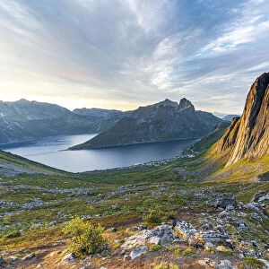 Sunrise over the clear water of the fjord and Segla mountain, Senja island, Troms county