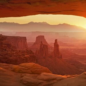 Sunrise over La Sal Mountains, Washer Woman Arch, and Mesa Arch, Island in the Sky, Canyonlands National Park, Utah, United States of America, North America