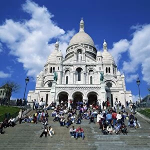 Tourists sitting on steps before the Sacre Coeur, Montmartre, Paris, France, Europe