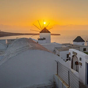 View of windmills at sunset in Oia village, Santorini, Aegean Island, Cyclades Island