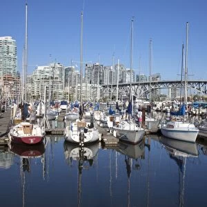 Yachts moored in False Creek at Granville Island with Granville Bridge