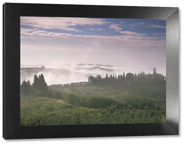 Early morning view across misty hills, near Certaldo, Tuscany, Italy, Europe