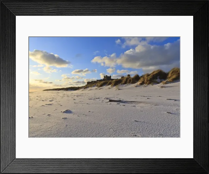 Framed Print : Fresh Spring snow at dawn highlight ripples and marks in the sand beneath Bamburgh Castle, Bamburgh, Northumberland, England Framed Print : Fresh Spring snow at dawn highlight ripples and marks in the sand beneath Bamburgh Castle, Bamburgh, Northumberland, England