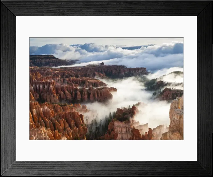 Framed Print : Pinnacles and hoodoos with fog extending into clouds of a partial temperature inversion, Bryce Canyon National Park, Utah, United States of America, North America