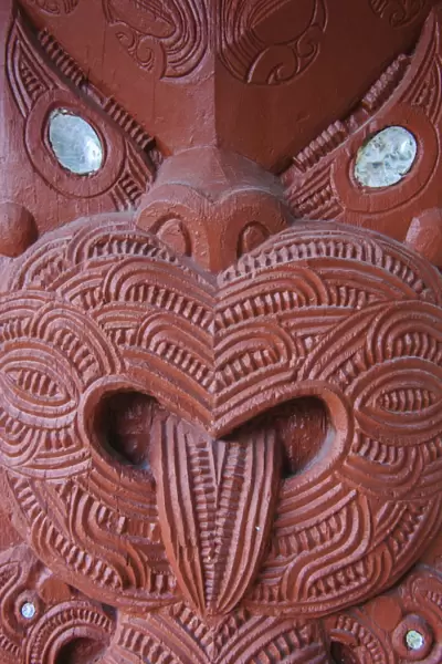 Traditional wood carved mask in the Te Puia Maori Cultural Center, Rotorura, North Island, New Zealand, Pacific