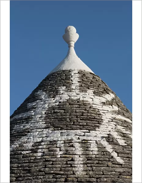 Sun painted on roof of traditional trullo in Alberobello, UNESCO World Heritage Site, Puglia, Italy, Europe