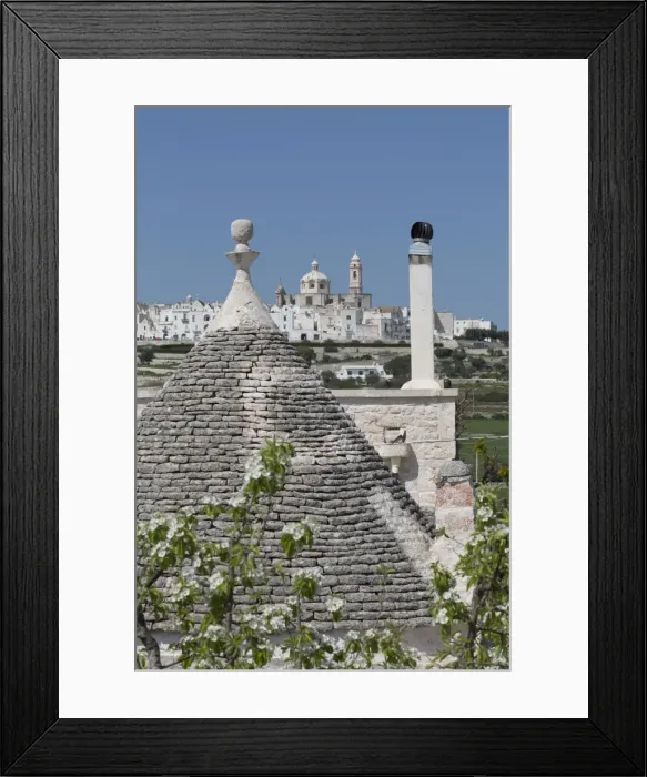 Framed Print : Roof of traditional trullo with Locorotondo in distance, Puglia, Italy, Europe Framed Print : Roof of traditional trullo with Locorotondo in distance, Puglia, Italy, Europe
