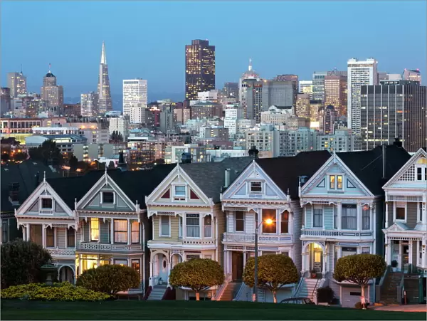 The Painted Ladies and the city at dusk, Alamo Square, San Francisco, California, United States of America, North America