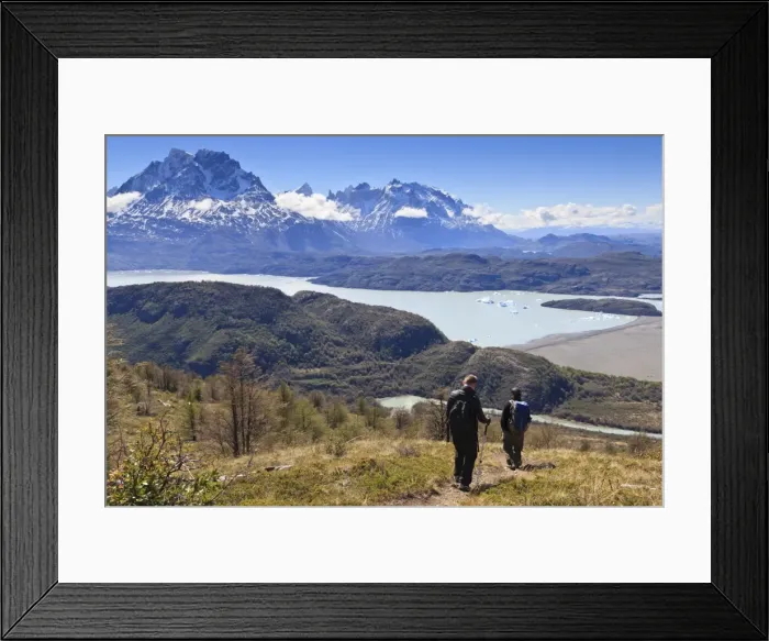 Framed Print : Hikers descend a grassy slope with lake, mountain and iceberg view; near Ferrier Vista Point, Torres del Paine, Patagonia, Chile, South America Framed Print : Hikers descend a grassy slope with lake, mountain and iceberg view; near Ferrier Vista Point, Torres del Paine, Patagonia, Chile, South America