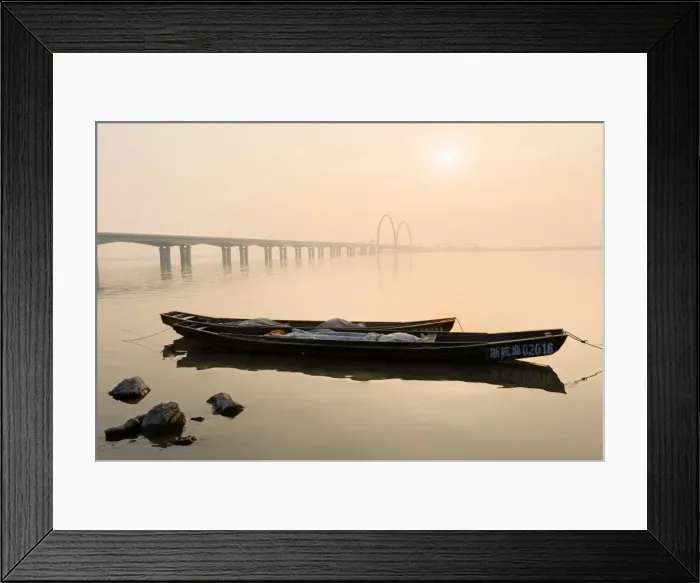 Framed Print : Fishing boats and modern bridge in mist at Qiantangjiang River in Hangzhou, Zhejiang, China, Asia Framed Print : Fishing boats and modern bridge in mist at Qiantangjiang River in Hangzhou, Zhejiang, China, Asia