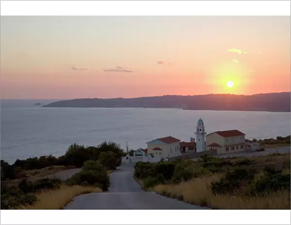 Sunset over Lourdata Bay, monastery prominent, near Lourdata, Kefalonia (Kefallonia, Cephalonia), Ionian Islands, Greek Islands, Greece, Europe