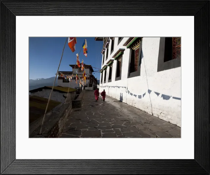 Framed Print : Buddhist monks in red robes walking in the early morning sunshine on the walls of Tawang Buddhist monastery, Arunachal Pradesh, India, Asia Framed Print : Buddhist monks in red robes walking in the early morning sunshine on the walls of Tawang Buddhist monastery, Arunachal Pradesh, India, Asia