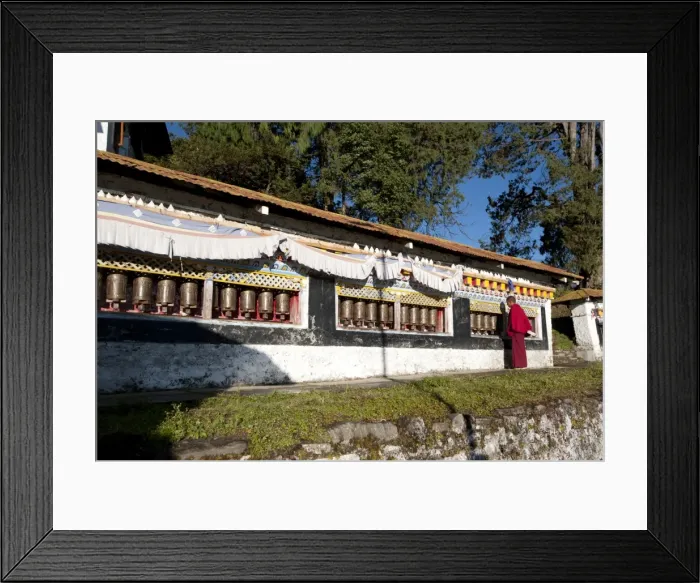 Framed Print : Buddhist monk in red robes turning prayer wheels in contemplative morning prayer, Tawang Buddhist monastery, Arunachal Pradesh, India, Asia Framed Print : Buddhist monk in red robes turning prayer wheels in contemplative morning prayer, Tawang Buddhist monastery, Arunachal Pradesh, India, Asia