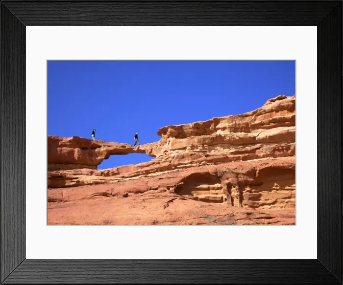 Framed Print : Tourists climbing at Wadi Rum, Jordan, Middle East Framed Print : Tourists climbing at Wadi Rum, Jordan, Middle East