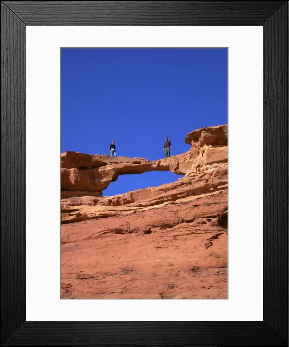 Framed Print : Tourists climbing at Wadi Rum, Jordan, Middle East Framed Print : Tourists climbing at Wadi Rum, Jordan, Middle East