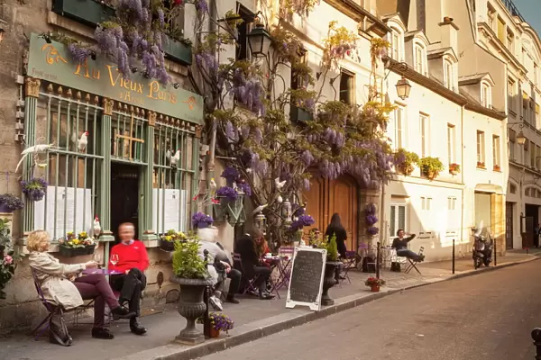 People outside a cafe on Ile de la Cite, Paris, France, Europe