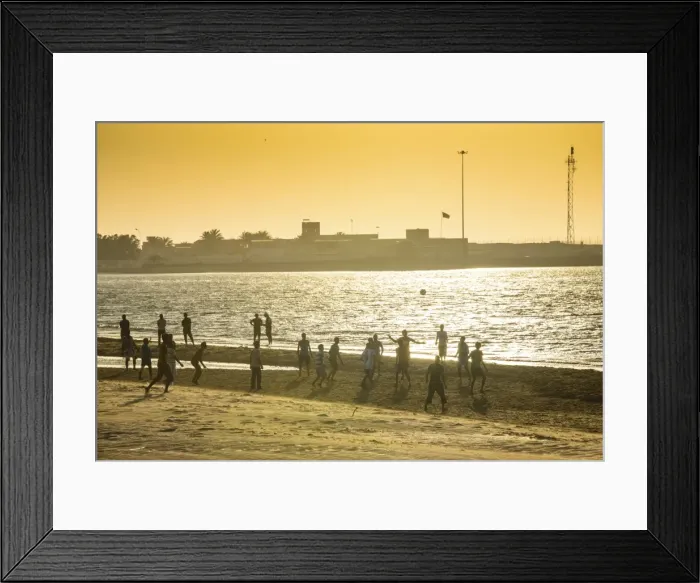 Framed Print : Backlight at men playing soccer at the beach of Bukha, Musandam, Oman, Middle East Framed Print : Backlight at men playing soccer at the beach of Bukha, Musandam, Oman, Middle East