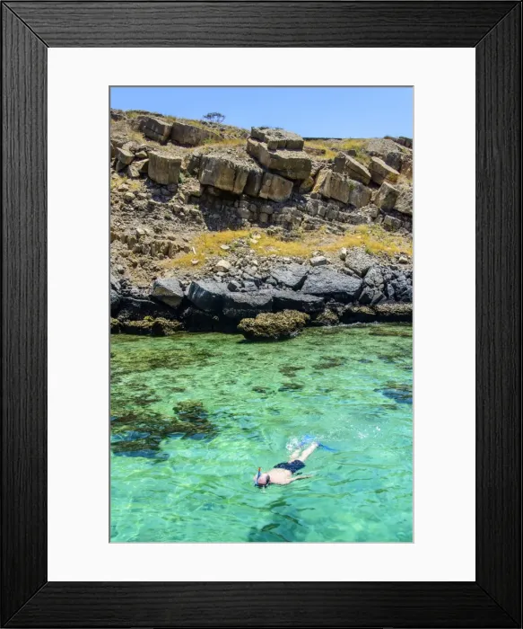Framed Print : Man snorkelling in the clear waters of Telegraph Island in the Khor ash-sham fjord, Musandam, Oman, Middle East Framed Print : Man snorkelling in the clear waters of Telegraph Island in the Khor ash-sham fjord, Musandam, Oman, Middle East