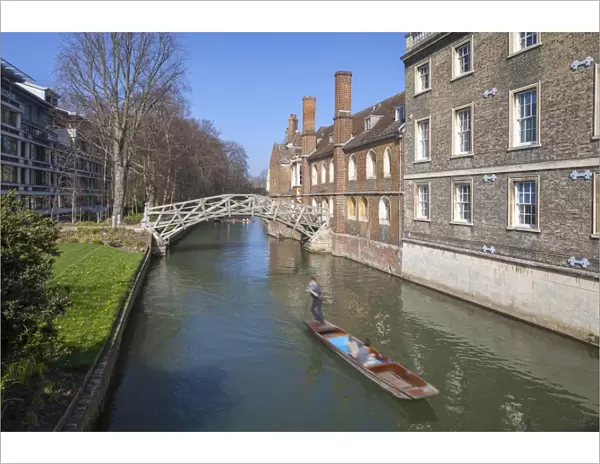 Mathematical Bridge, connecting two parts of Queens College, with punters on the river beneath, Cambridge, England, United Kingdom, Europe