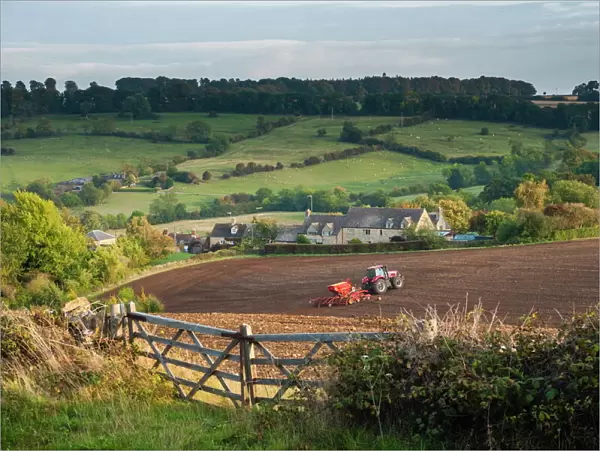 Tractor ploughing fields in Blockley, The Cotswolds, Gloucestershire, England, United Kingdom, Europe